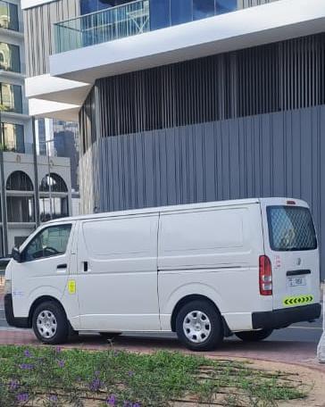 Dubai Van Movers white delivery van at a construction site